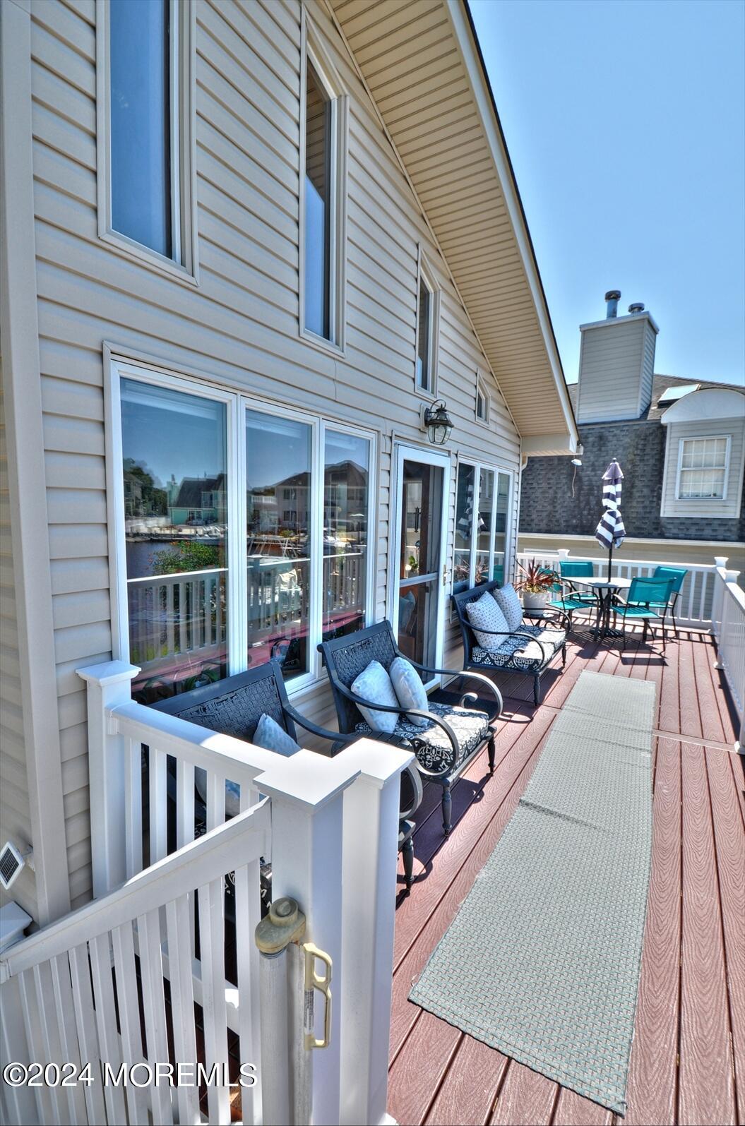 100 Cedar Run Road Bayville, NJ 08721 - Photo 23 of 39 a view of a patio with couches chairs and potted plants