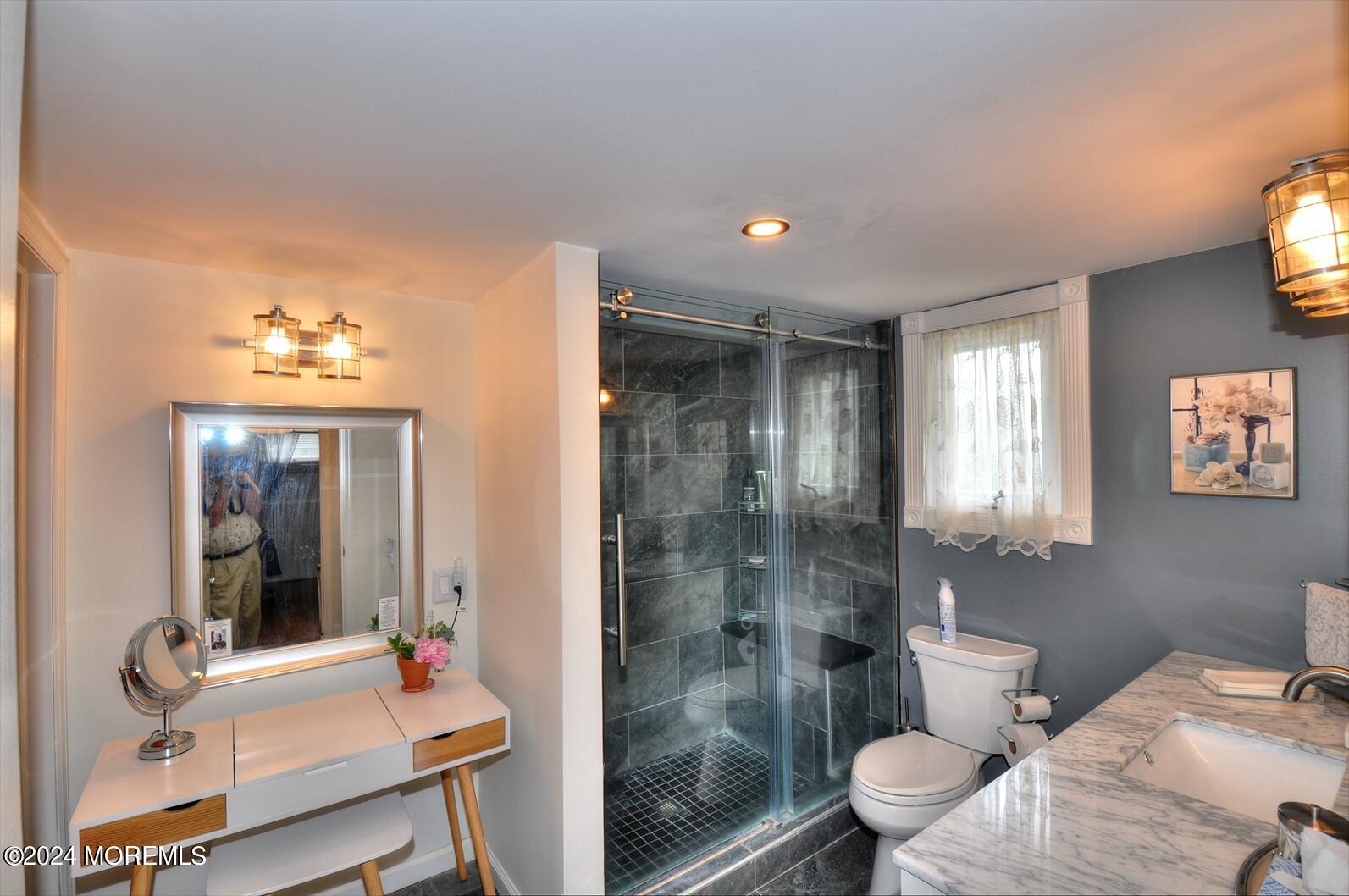 100 Cedar Run Road Bayville, NJ 08721 - Photo 33 of 39 a bathroom with a bathtub shower sink mirror and toilet