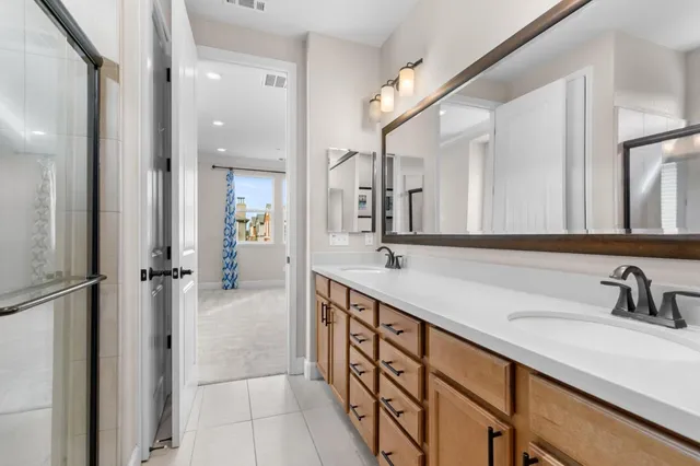 a bathroom with a glass door shower