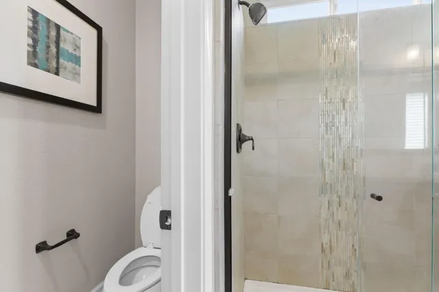 a bedroom with bed and a window