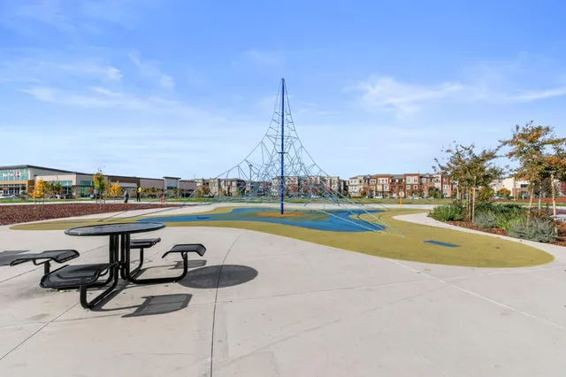 a view of a cars park in front of a building
