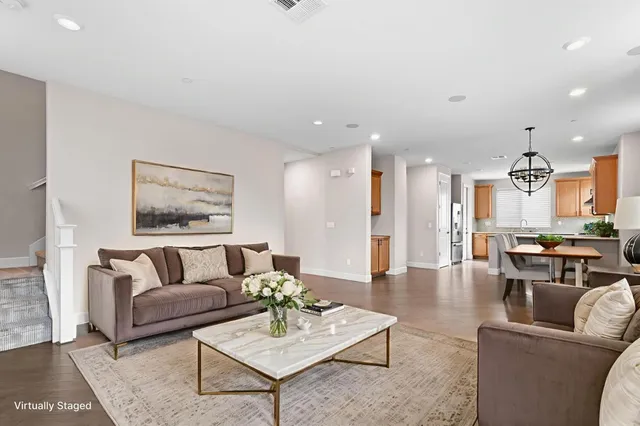 a living room with furniture and a table