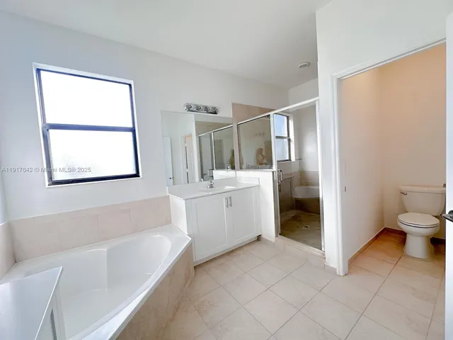 a bathroom with a bathtub sink and toilet