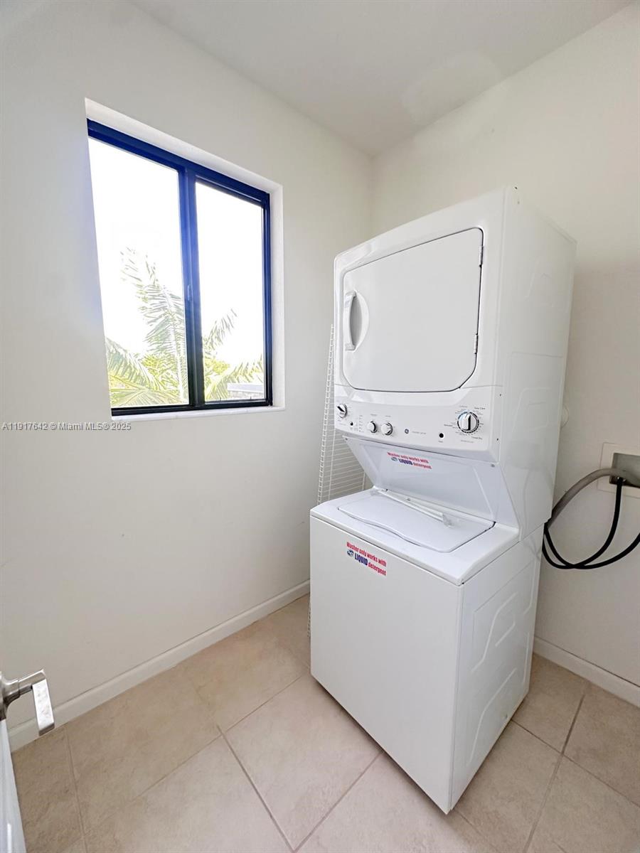 244 Northeast 210th Way, Unit 244 Miami, FL 33179 - Photo 23 of 32 a utility room with dryer and washer