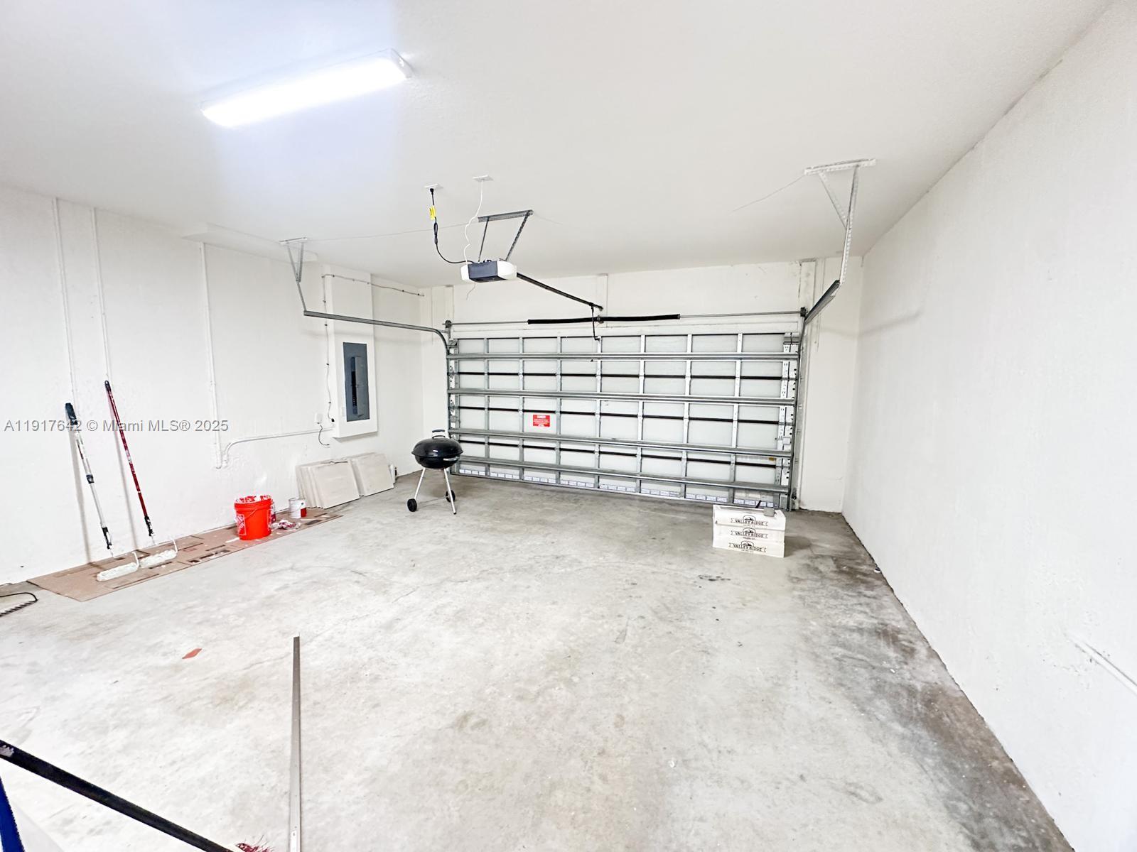 244 Northeast 210th Way, Unit 244 Miami, FL 33179 - Photo 24 of 32 a view of room and stairs