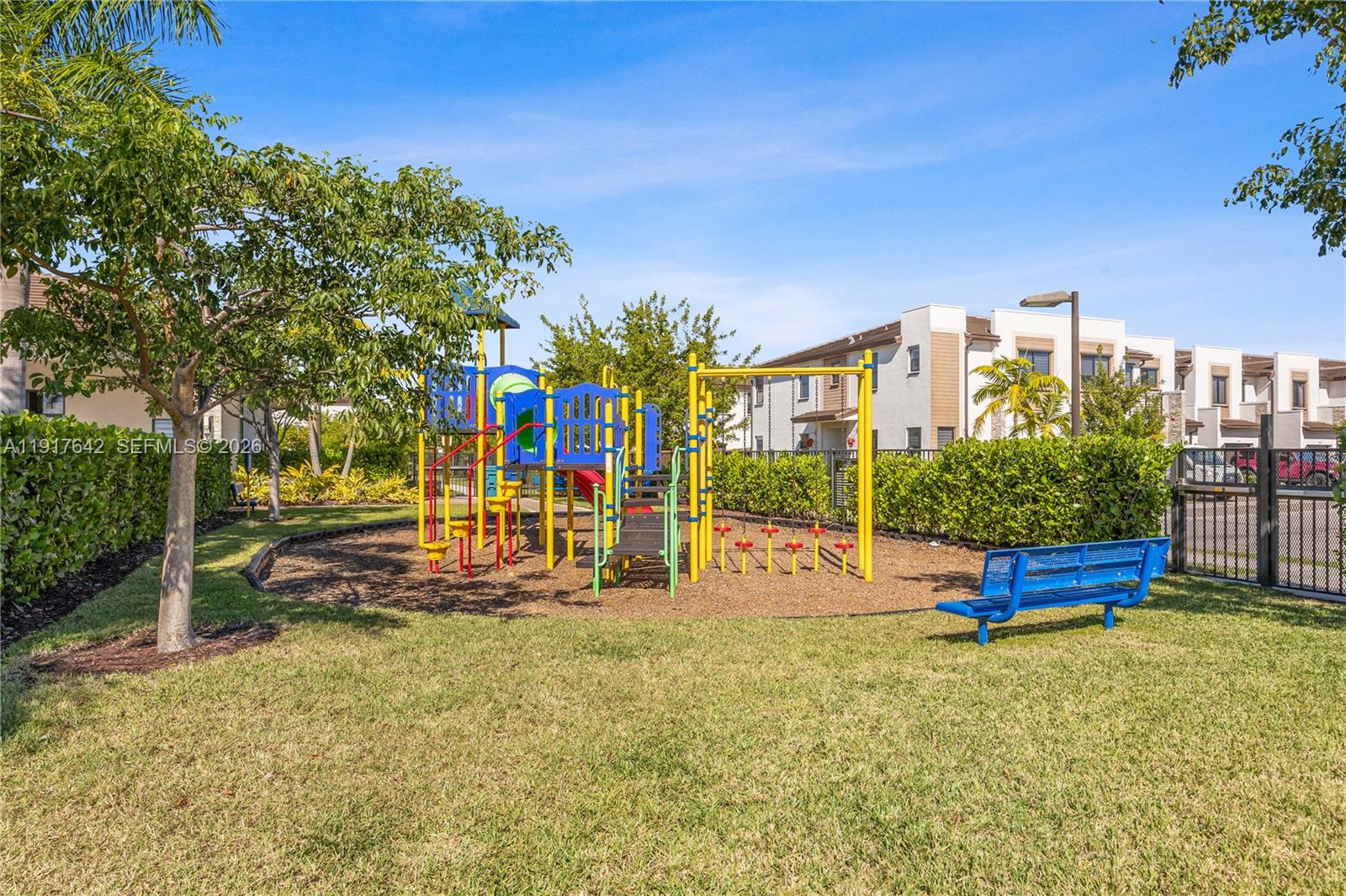 244 Northeast 210th Way, Unit 244 Miami, FL 33179 - Photo 27 of 32 a view of a park with large trees