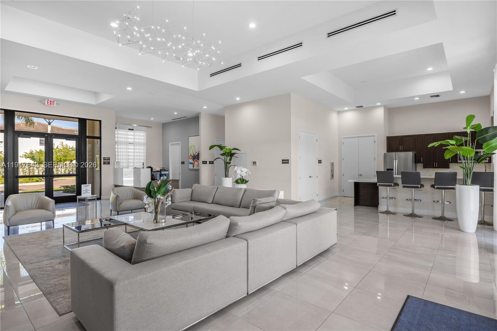 244 Northeast 210th Way, Unit 244 Miami, FL 33179 - Photo 28 of 32 a living room with furniture and potted plants