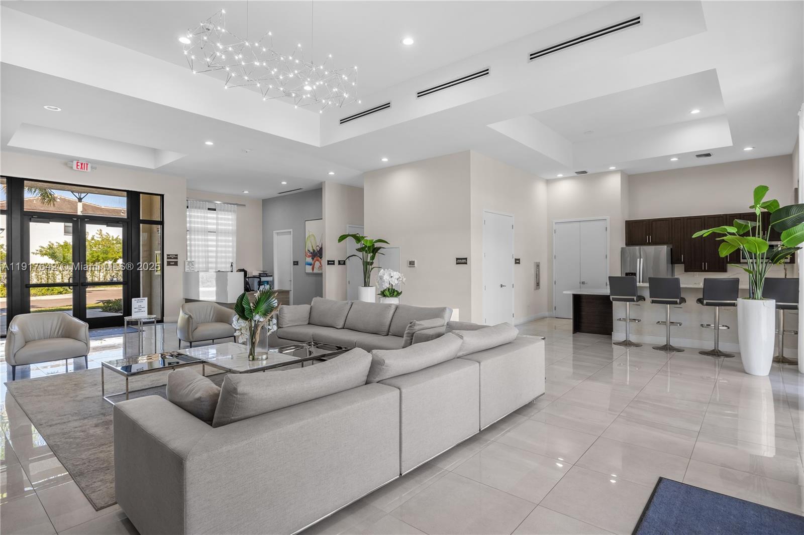 244 Northeast 210th Way, Unit 244 Miami, FL 33179 - Photo 28 of 32 a living room with furniture and potted plants