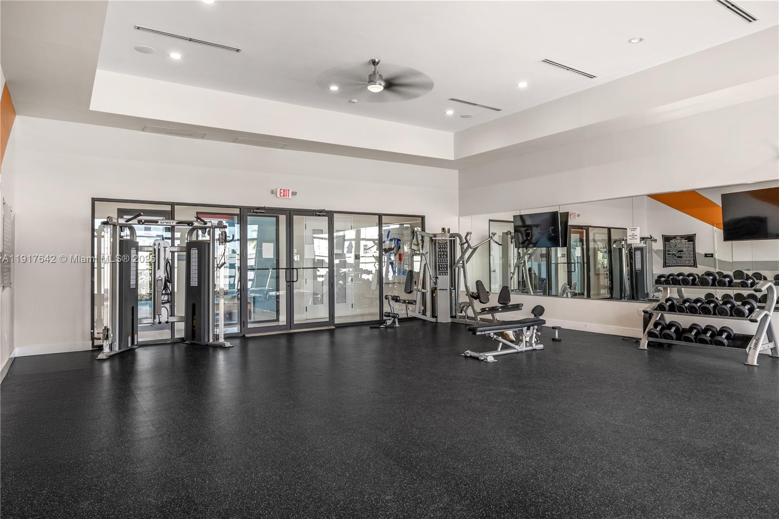 244 Northeast 210th Way, Unit 244 Miami, FL 33179 - Photo 29 of 32 a view of a room with gym equipment