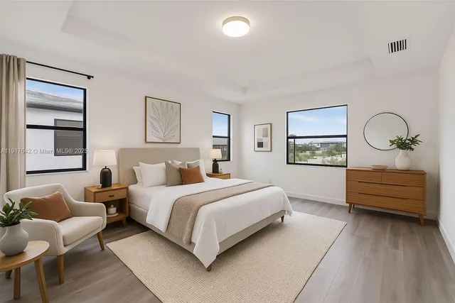 a bedroom with a bed and a couch