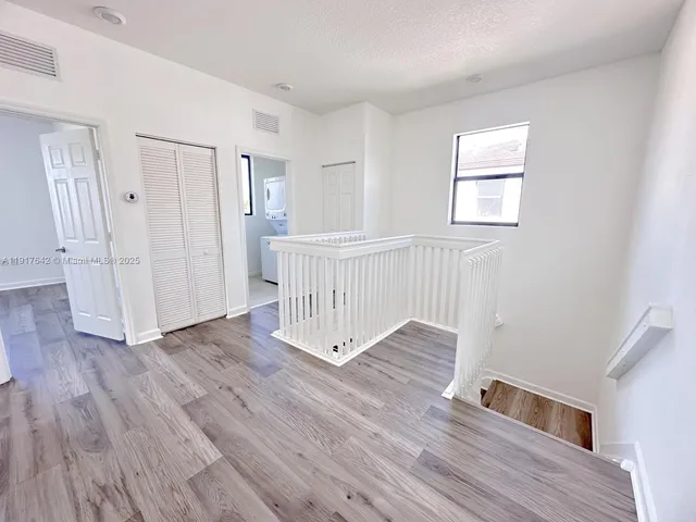 a view of a livingroom with wooden floor