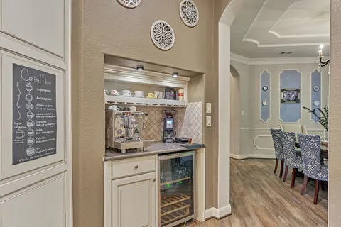 a kitchen with a refrigerator and cabinets