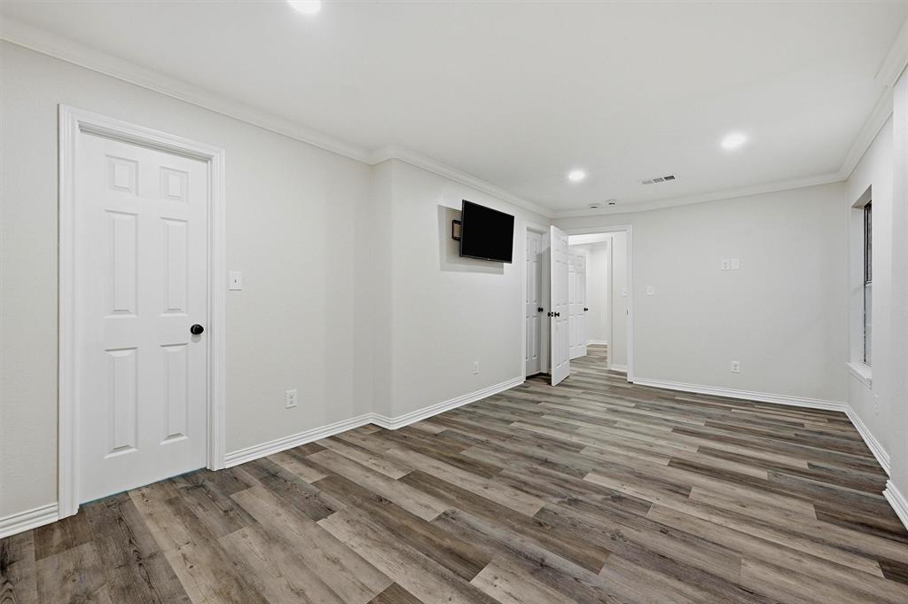 909 Thatcher Street Denison, TX 75020 - Photo 11 of 24 a view of empty room with wooden floor
