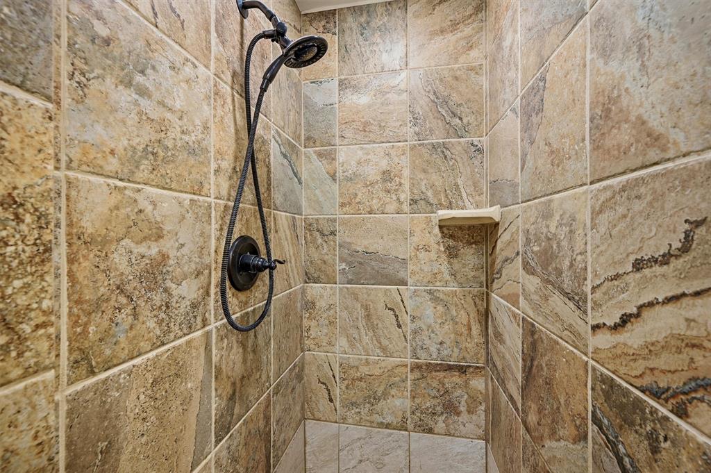 909 Thatcher Street Denison, TX 75020 - Photo 17 of 24 a bathroom with a shower