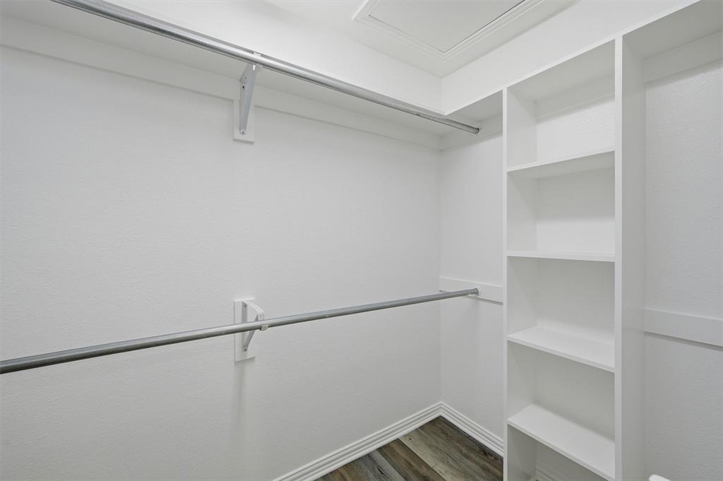 909 Thatcher Street Denison, TX 75020 - Photo 18 of 24 a view of an empty walk in closet