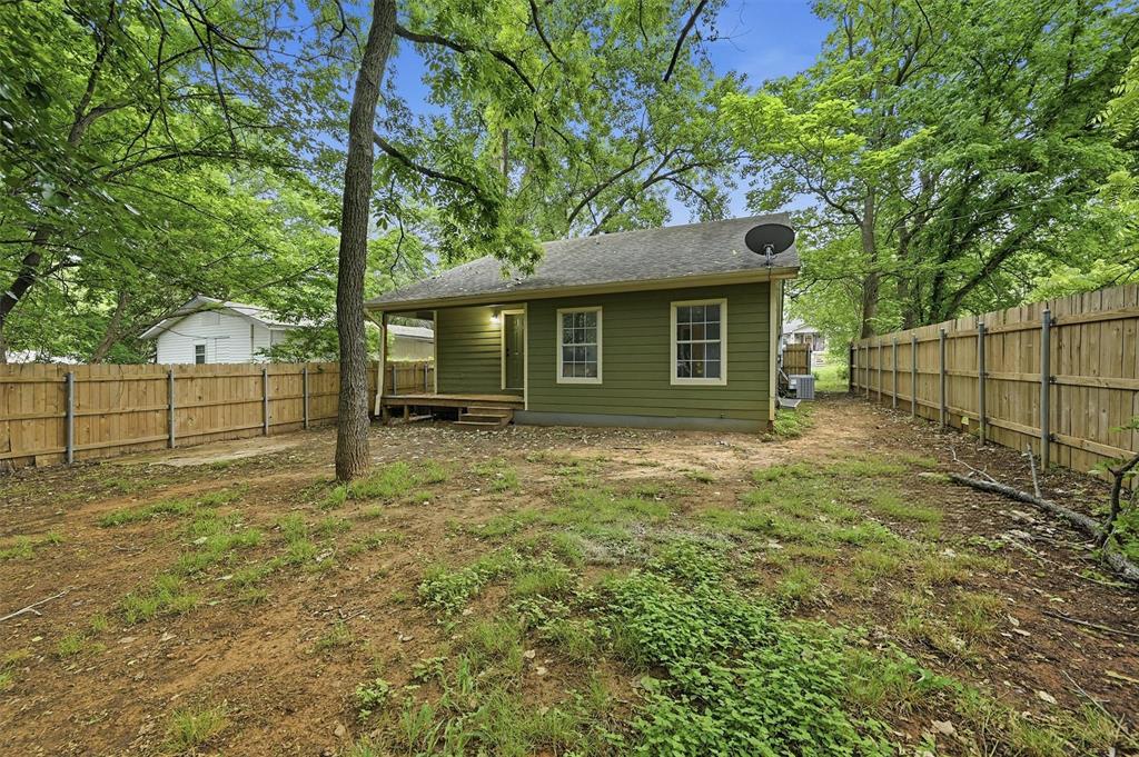 909 Thatcher Street Denison, TX 75020 - Photo 19 of 24 a view of house with backyard and garden