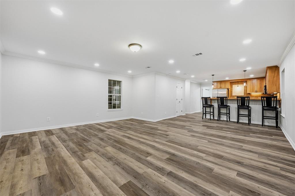 909 Thatcher Street Denison, TX 75020 - Photo 2 of 24 a view of a room with wooden floor