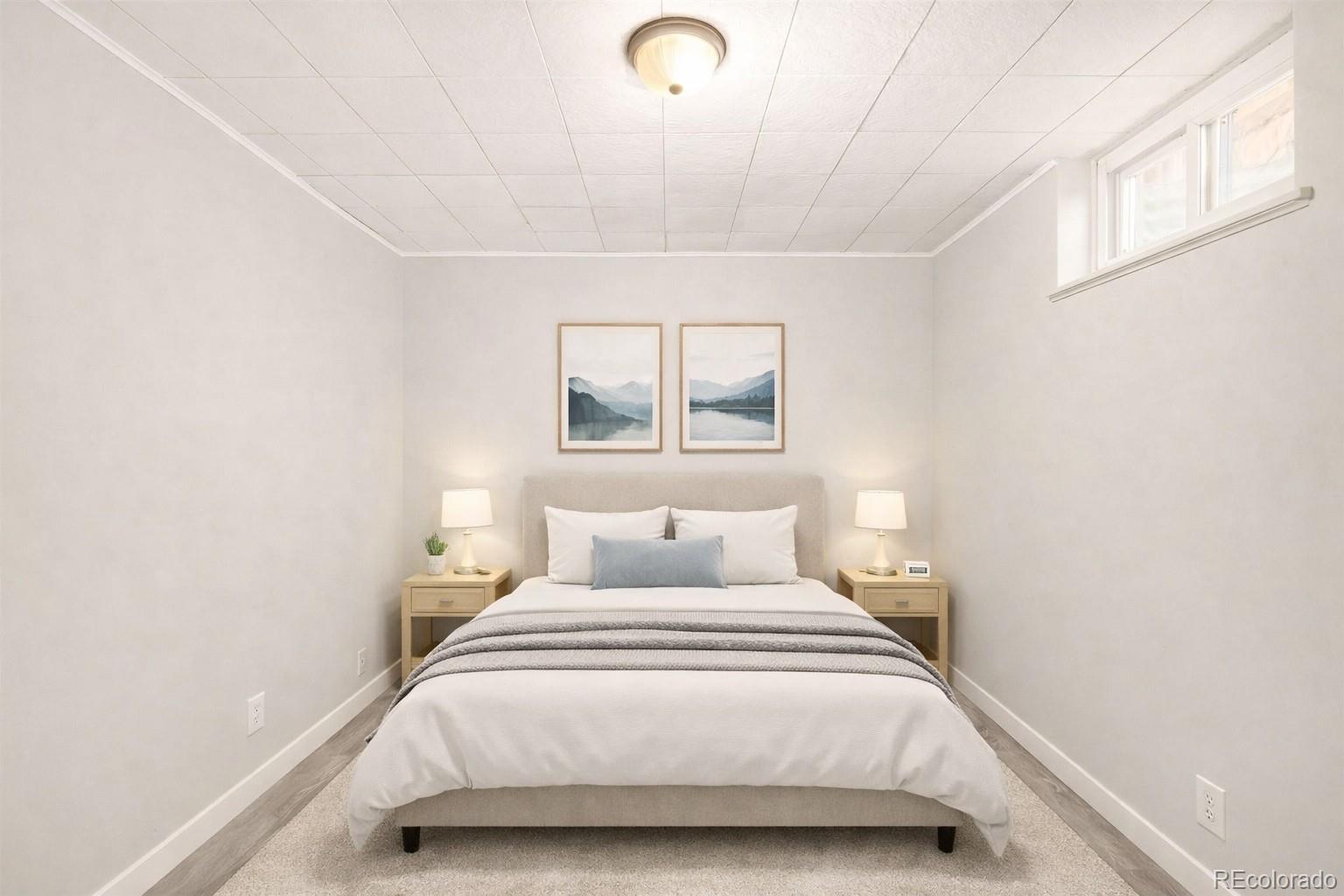 2438 South Perry Street Denver, CO 80219 - Photo 14 of 24 a bedroom with a bed and window