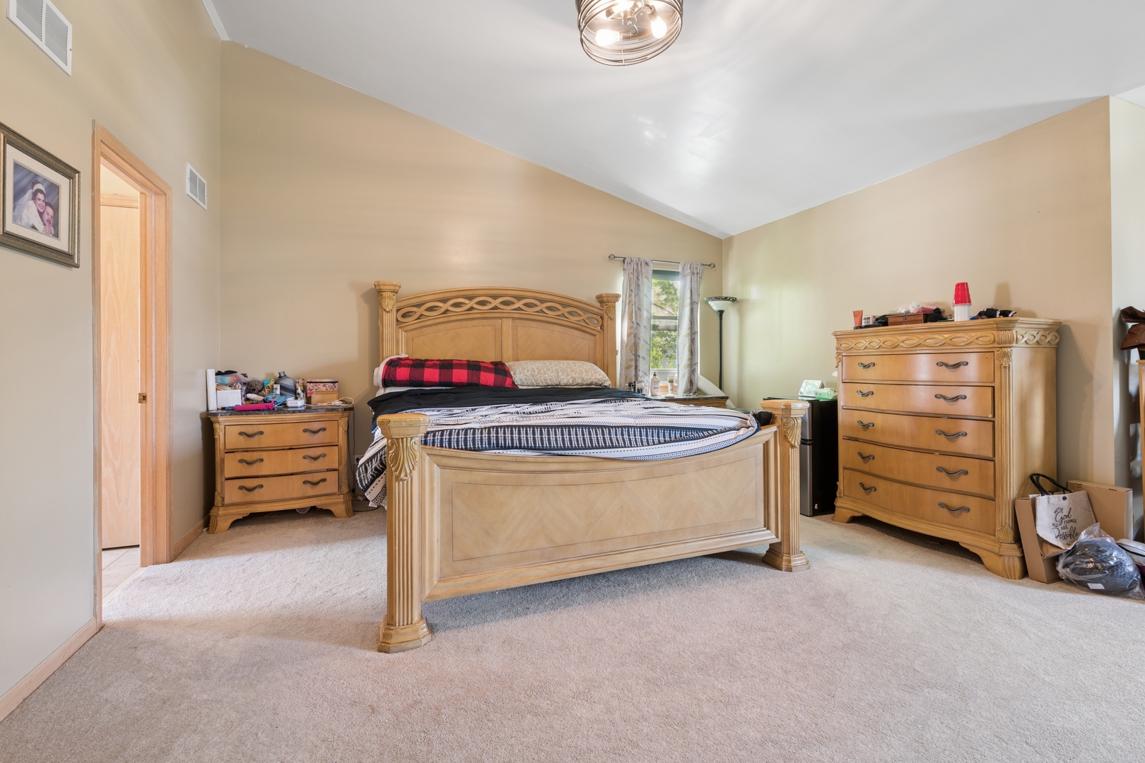 2014 Fieldstone Court Plainfield, IL 60586 - Photo 15 of 25 a bedroom with a bed and a cabinets