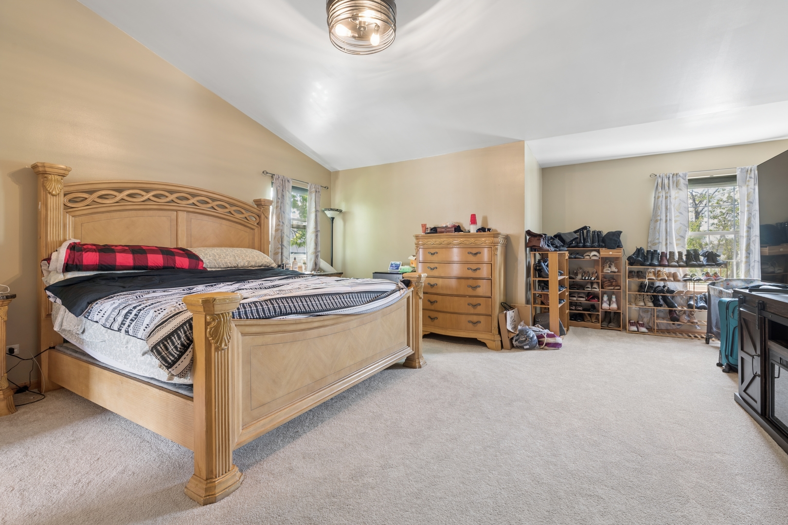 2014 Fieldstone Court Plainfield, IL 60586 - Photo 16 of 25 a bedroom with bed and a chandelier