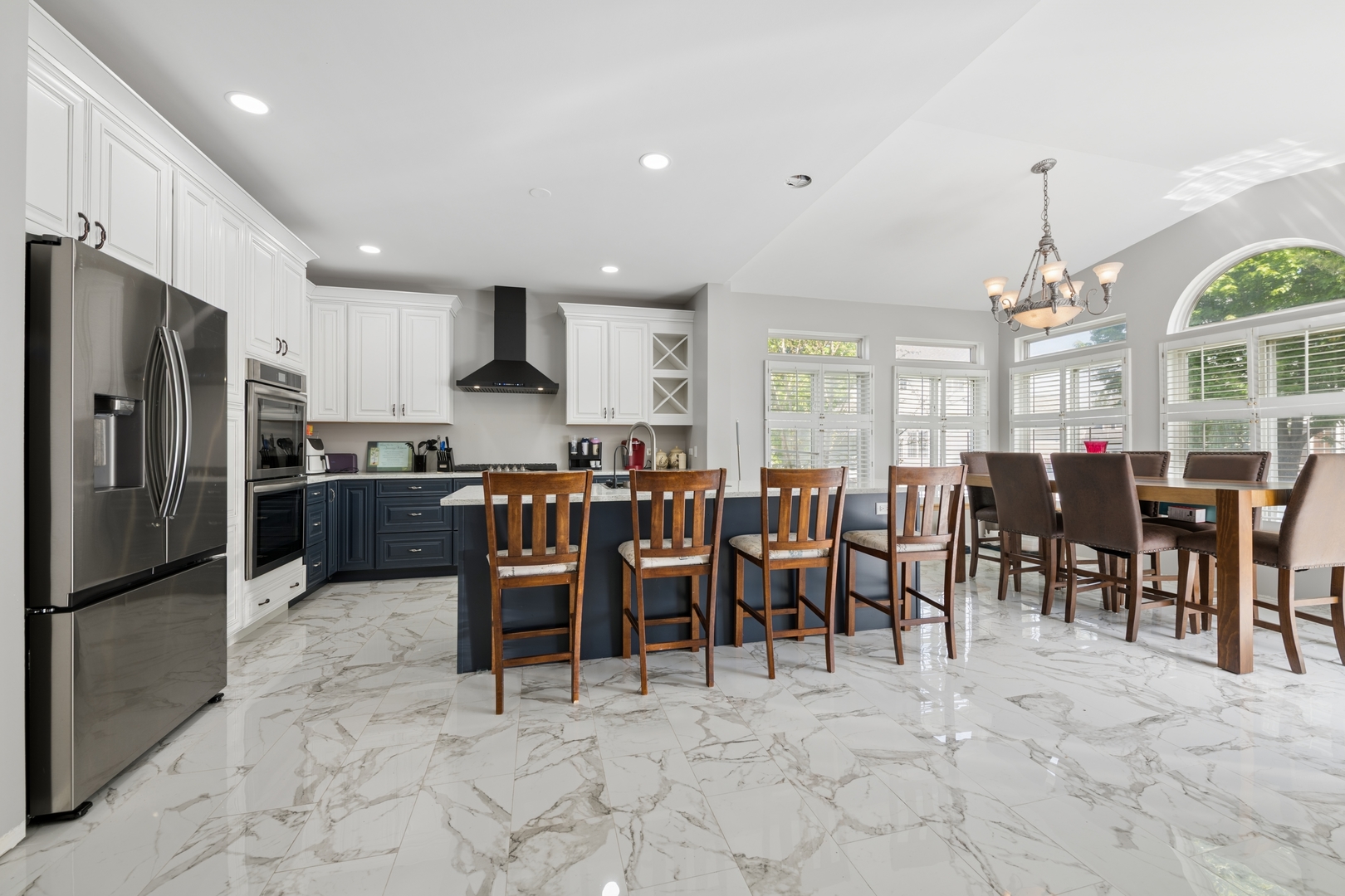 2014 Fieldstone Court Plainfield, IL 60586 - Photo 4 of 25 a large dining space with furniture a chandelier and window