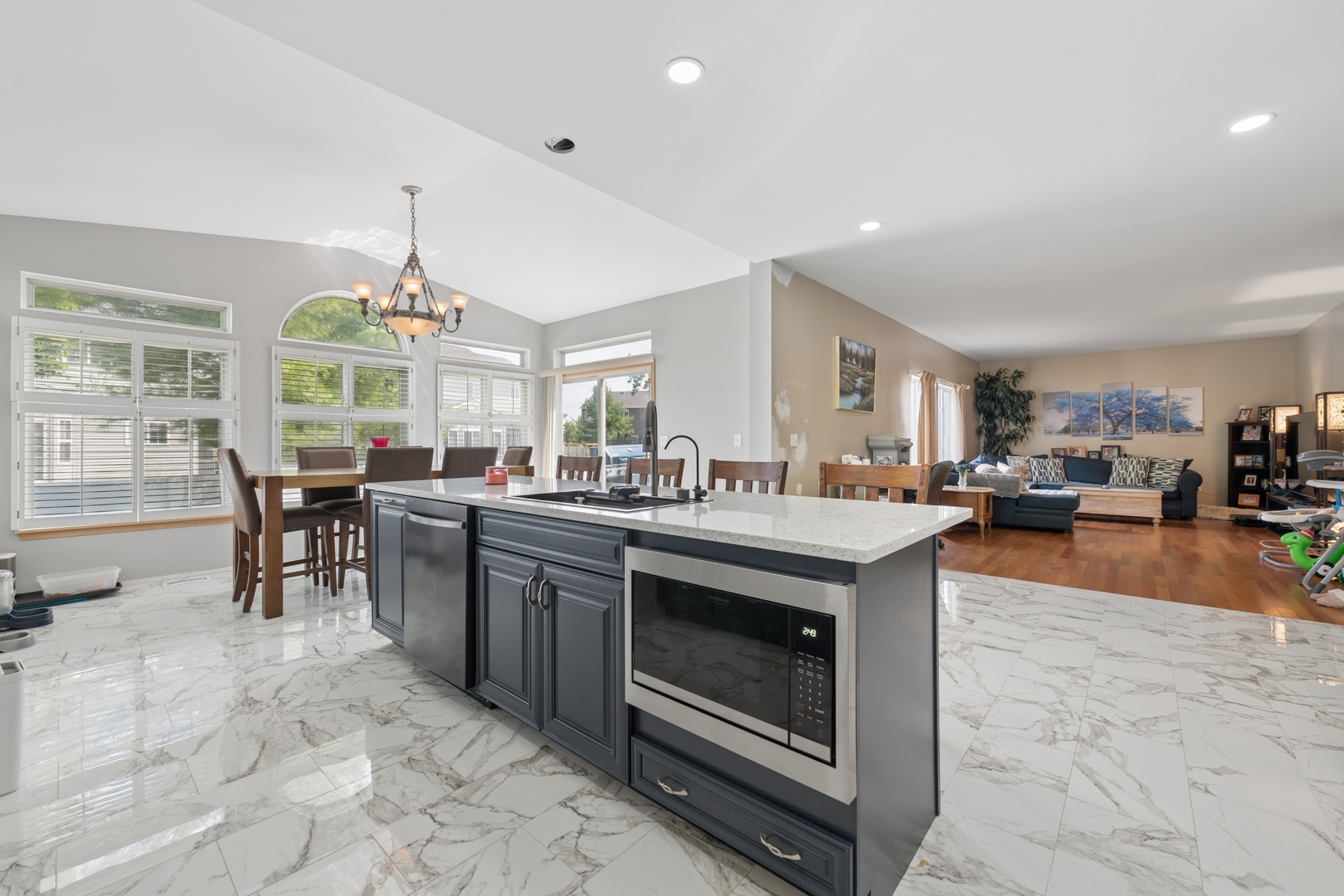 2014 Fieldstone Court Plainfield, IL 60586 - Photo 6 of 25 a kitchen with stainless steel appliances granite countertop a stove and a view of living room