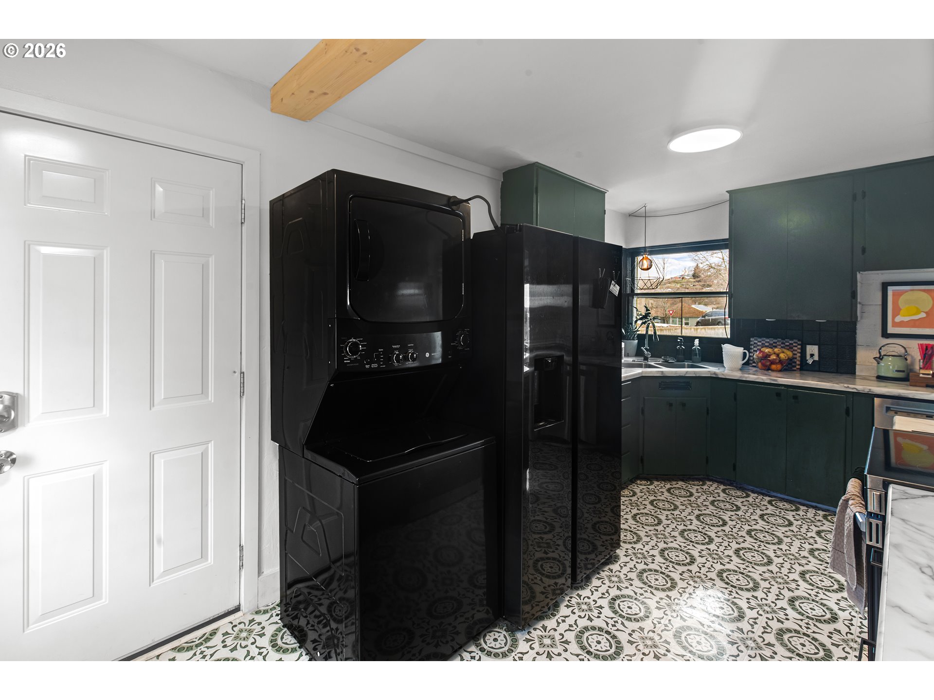 735 Northwest 10th Street Pendleton, OR 97801 - Photo 15 of 38 a kitchen with stainless steel appliances kitchen island granite countertop cabinets and refrigerator
