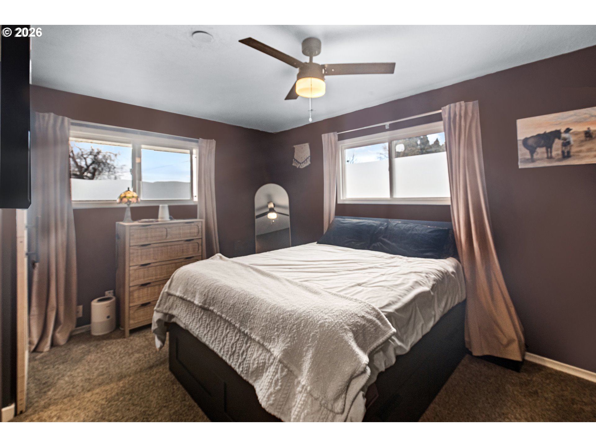 735 Northwest 10th Street Pendleton, OR 97801 - Photo 17 of 38 a bedroom with a bed next to a window