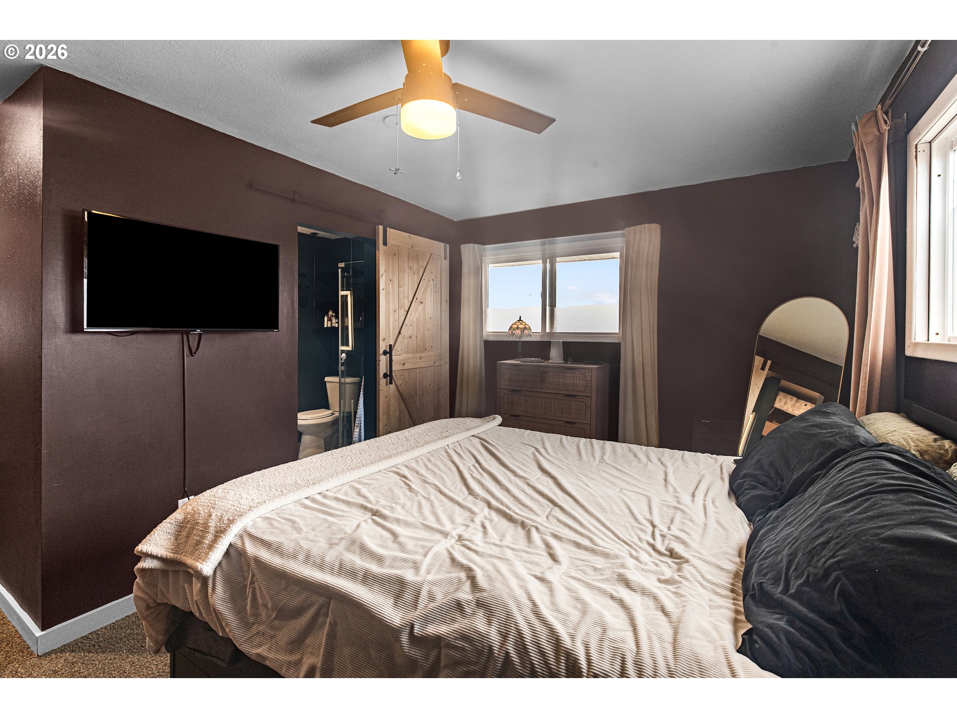 735 Northwest 10th Street Pendleton, OR 97801 - Photo 18 of 38 a bedroom with a bed and a flat screen tv