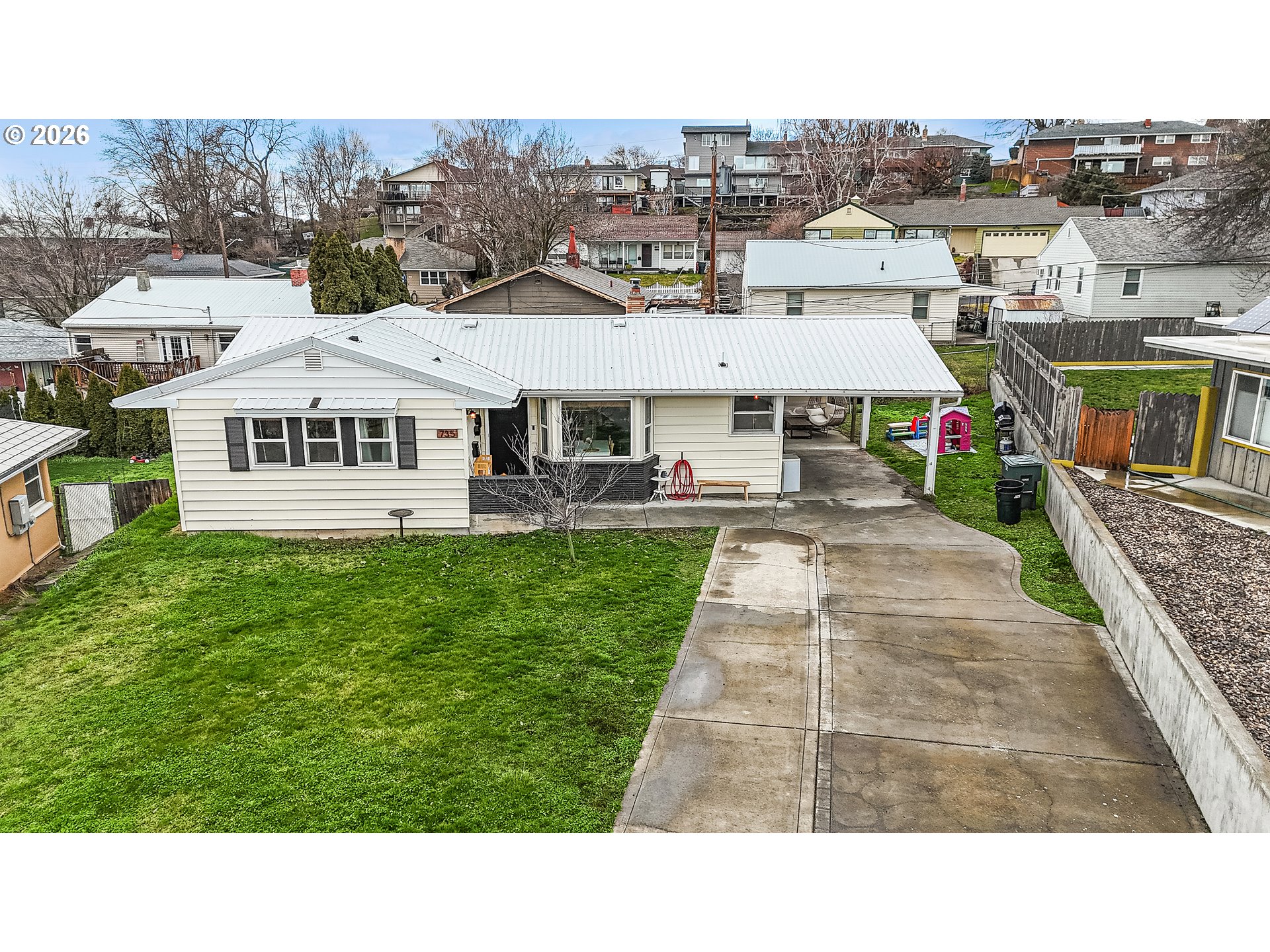 735 Northwest 10th Street Pendleton, OR 97801 - Photo 2 of 38 a aerial view of a house with a yard table and chairs