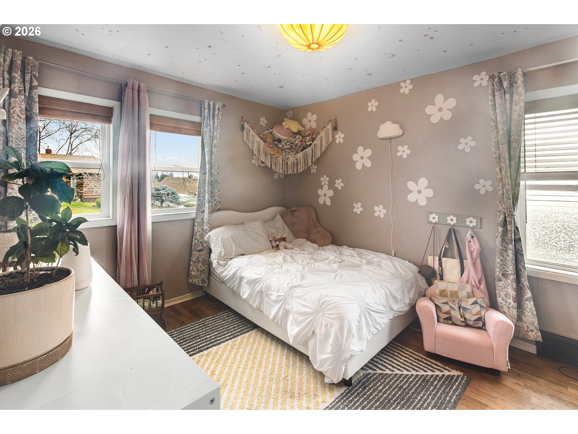 735 Northwest 10th Street Pendleton, OR 97801 - Photo 22 of 38 a bedroom with a bed lamp and a potted plant