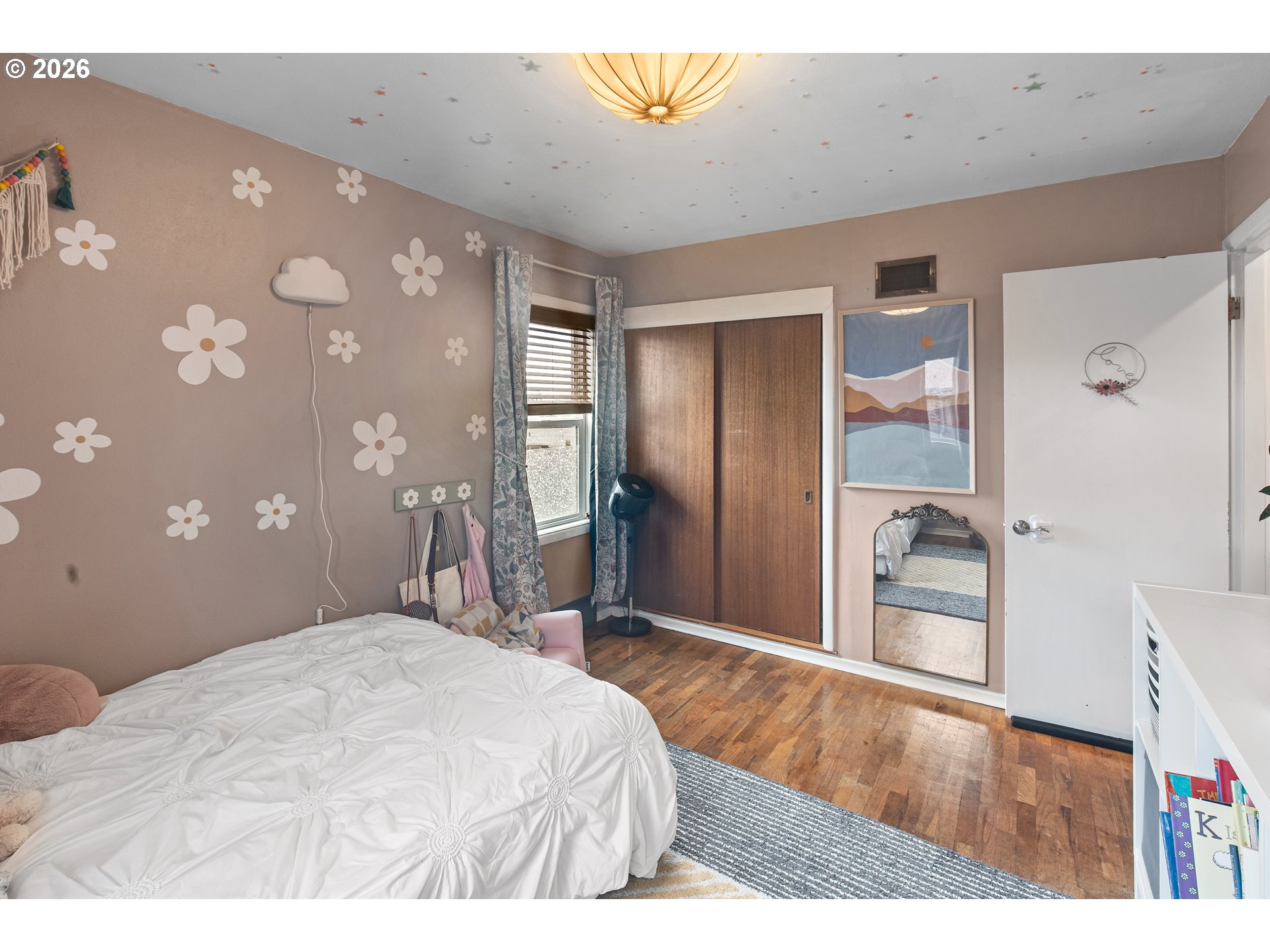 735 Northwest 10th Street Pendleton, OR 97801 - Photo 23 of 38 a bedroom with a bed and a painting on the wall