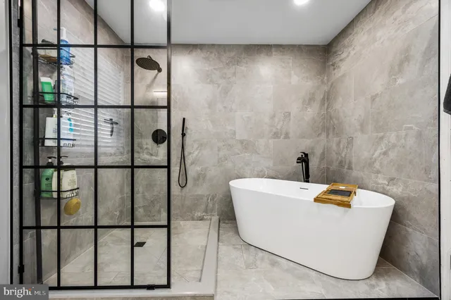 a bedroom with a bed a desk and chair