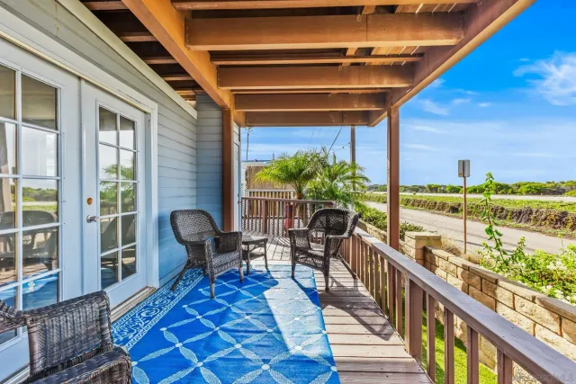 a view of a balcony with chairs