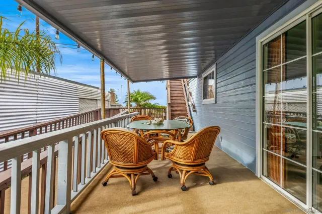a view of balcony with furniture