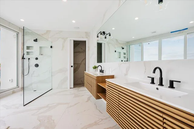 a bathroom with a bathtub and a shower