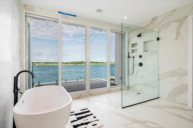 a bathroom with a bathtub and a sink