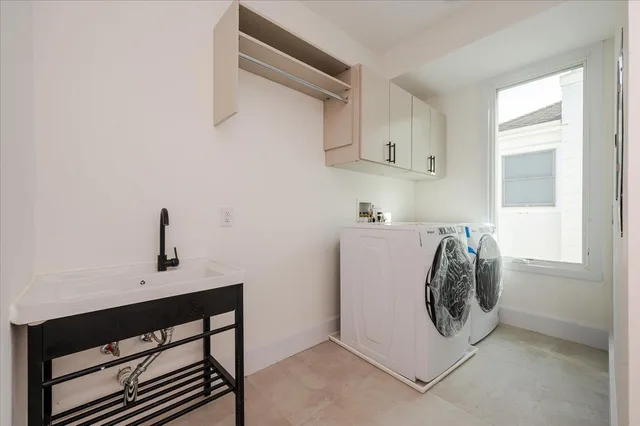 a view of building with car parked