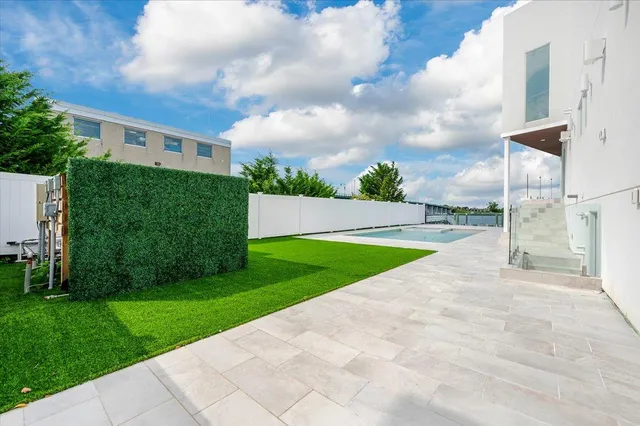 a view of a swimming pool and an outdoor seating