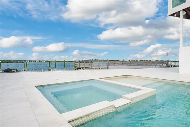 a view of a backyard with sitting area