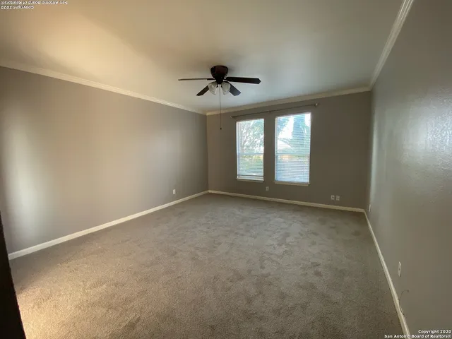 a view of entryway with bathtub and shower