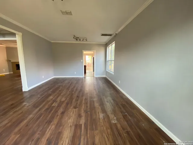 a view of an empty room and window