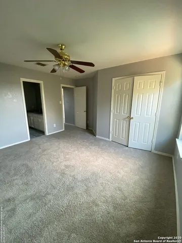a bathroom with a granite countertop sink a toilet and bathtub