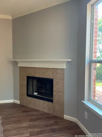 a living room with a fireplace and a fireplace
