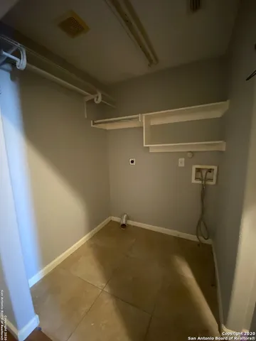 a view of a room with racks on the wall