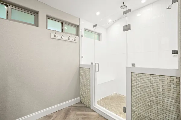 a bathroom with a shower and a sink