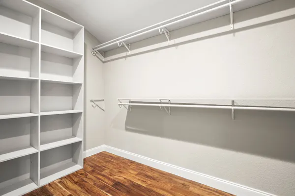 a view of an empty walk in closet