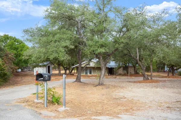 a house with trees in the background