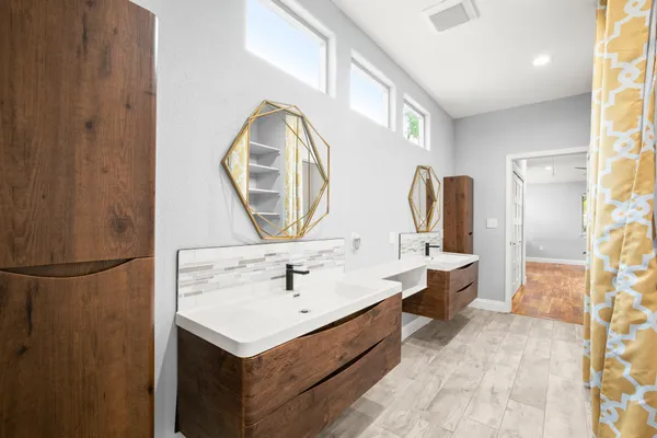 a bathroom with a sink and a mirror