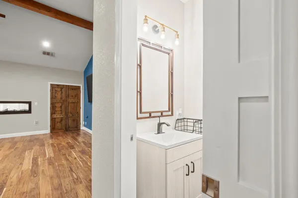 a bathroom with a sink and a mirror